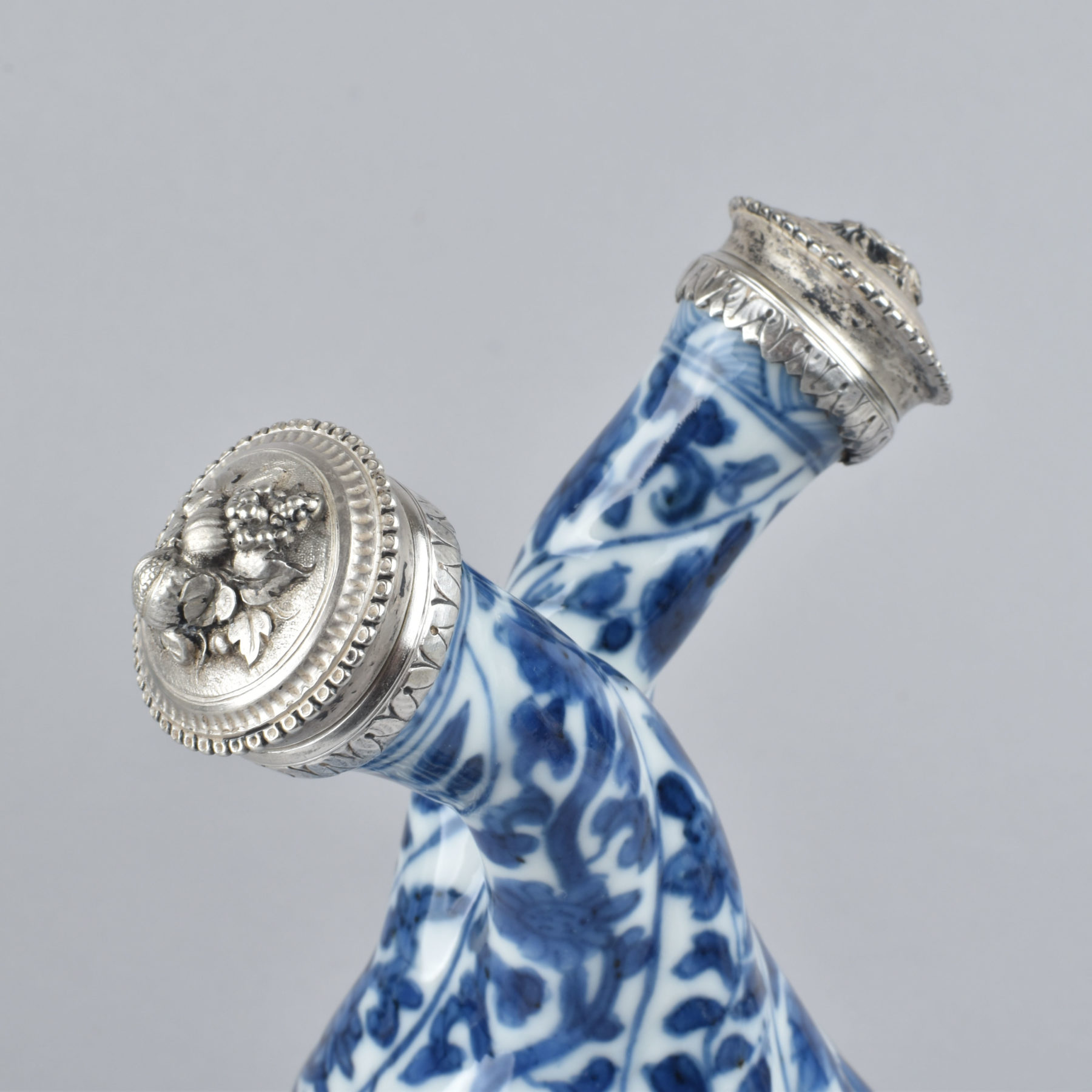 A Chinese blue and white silvered mounted doublebodied cruet. Kangxi